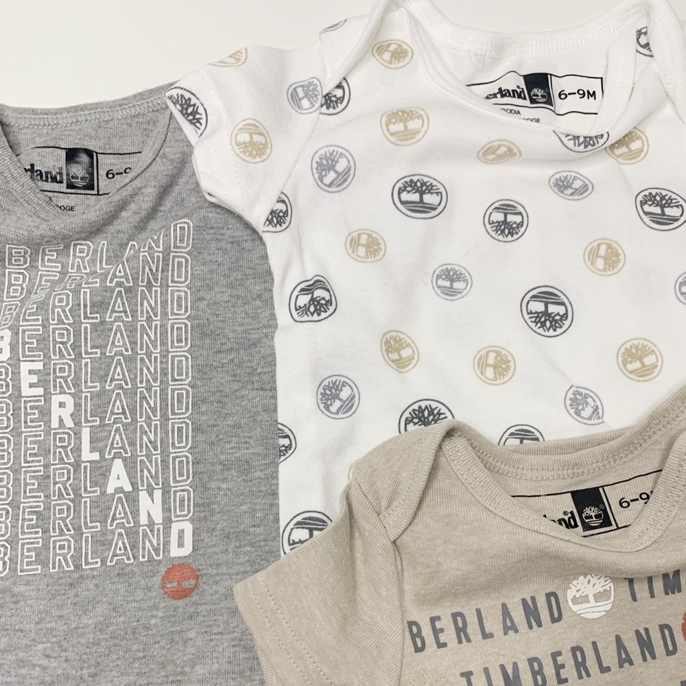 6-9M Timberland Variety Graphic Onesie 4pc. Bundle